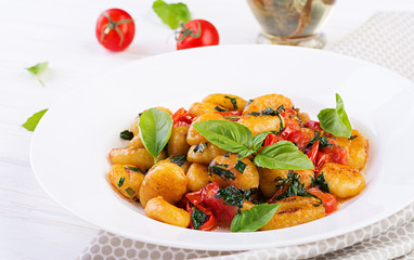 Gnocchi pasta in rustic style.  Italian cuisine. Vegetarian vegetable pasta. Cooking lunch. Gourmet dish.