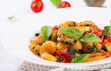 Gnocchi pasta in rustic style.  Italian cuisine. Vegetarian vegetable pasta. Cooking lunch. Gourmet dish.