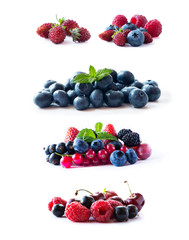 Ripe blueberries, blackberries, blackcurrants, strawberries, raspberries, gooseberries and red currants isolated on white. Mix berries with copy space for text. Various fresh summer berry.