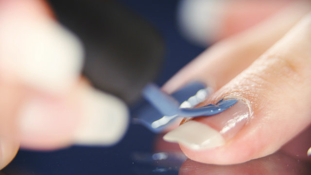 Long Fingernails Blue Nail Polish Close-up