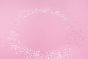 Pink pastel festive background with sparkles. Copy space for your text. Flat lay style. Top view. 