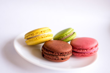 colorful macaroons on white background