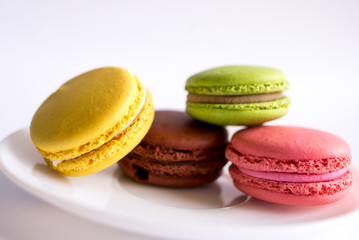 colorful macaroons on white background