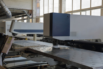 Fototapeta na wymiar Modern industrial machine with digital program control for metal working in the factory workshop