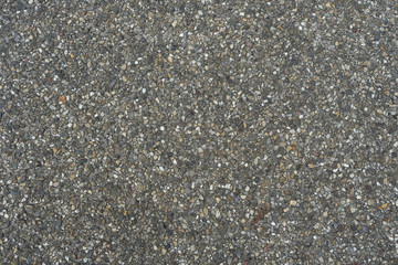 tar asphalt road texture with small pieces of rock pebble texture pattern