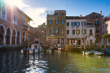 Fototapeta premium Sunny winter day in Venice, shot from channel