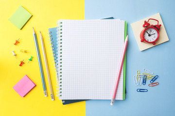 Clean white notebook and pencil with copy space on yellow blue table background for presentation, writer or school education, blogger, novel and friction or brand story concept.