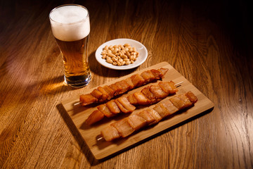 Fish barbecue with glass of bear