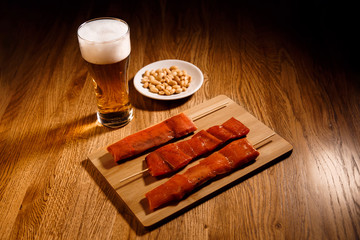 Fish barbecue with glass of bear