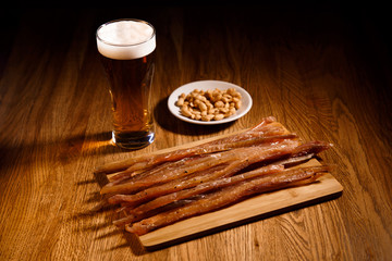 Fish barbecue with glass of bear