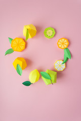 exotic fruits made of paper on pink background