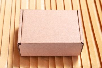 Brown cardboard box on lot of bubble envelopes