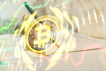 Cryptocurrency hologram over hands taking notes background. Concept of blockchain. Multi exposure