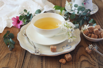 Decorative composition of vintage style: romantic tea drinking with jasmine tea