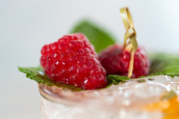 Raspberry Mojito Lemonade with lime and fresh mint in glass