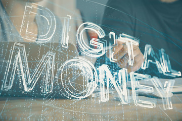 Crypto currency theme hologram with businessman working on computer on background. Concept of blockchain. Double exposure.