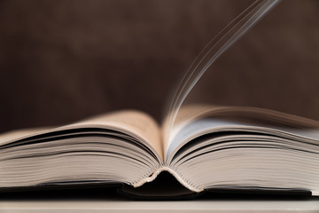 open book on gray background. Back to school