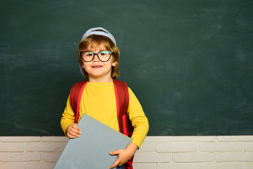 Back to school - education concet. Happy school kids. Schoolboy. Little student boy happy with an excellent mark.