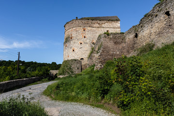 Part of the stone medieval fortifications in the city of Kamianets-Podilskyi. Summer landscape, Ukraine.