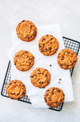 Homemade chocolate chips cookies on a wire rack.