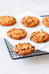 Homemade chocolate chips cookies on a wire rack.