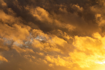 Storm clouds illuminated by the sunset sun. Free space.