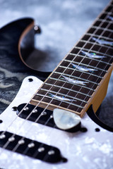 Fototapeta premium Electric guitar close up. Wooden background. 