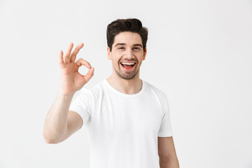 Full length portrait of a cheerful young man