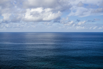 Obraz premium Atlantic ocean evening view , with horizon and white clouds background, Tenerife, Canary islands, Spain