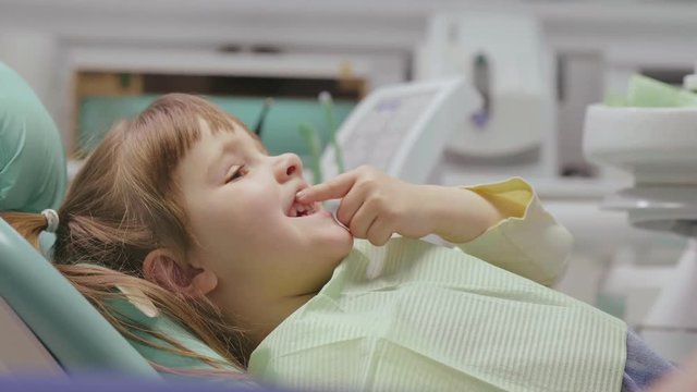 Little girl examined by her dentist
