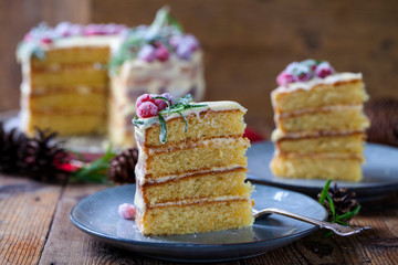 Layered Christmas cake with sugared cranberries and rosemary