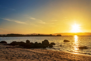 Fototapeta na wymiar Beach at sunset in Arousa Island