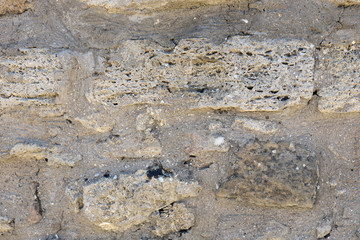 Background of ancient brick wall. Texture of old stone for design.