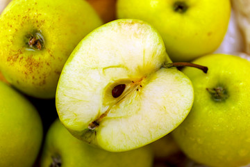 Fresh Juicy Ripe green apples on table. Organic green apples. Golden ripe apples.