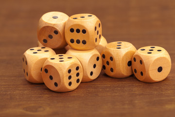 Dice on a wooden table. Concept for business risk.