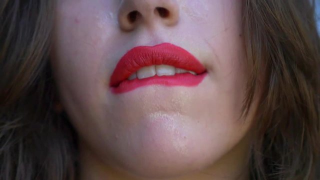 Sexy girl licks her tongue lips, kiss on camera.