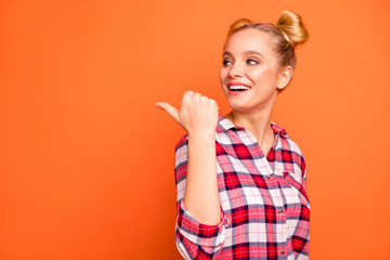 Close up photo beautiful nice she her lady perfect appearance hand arm thumb finger indicate side empty space advising buy buyer wear casual checkered plaid pink shirt isolated orange background