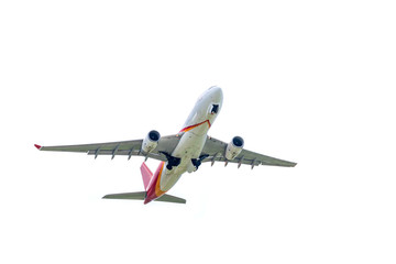 Airplane takes off from international airport isolated on white background