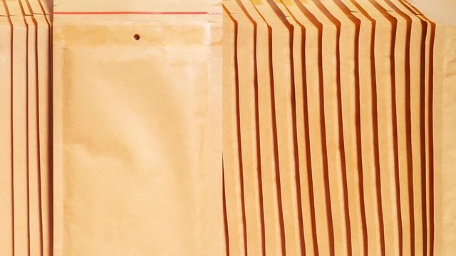 Stack of bubble envelopes, textured background