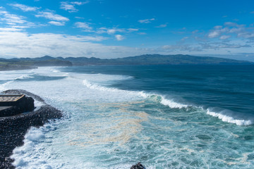 Amazing view of Atlantic Shore at Ribeira Grande. Blue water and clouds. Island of Sao Miguel, Azores Islands, Portugal, Europe