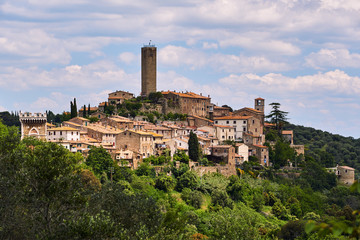 Medieval fortified gate and towers in city of Pereta in Tuscany, Italy.