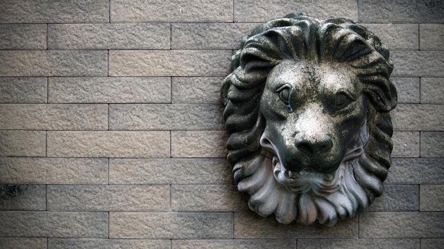 Lion Head Knocker On Brick​ Wall​