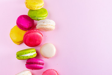 Macaroons cookies on pink