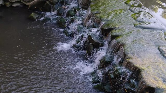 Decorative waterfall on the river