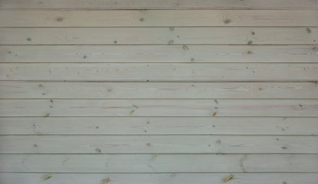 Abstract background of the wooden panel of unpainted, parallel boards