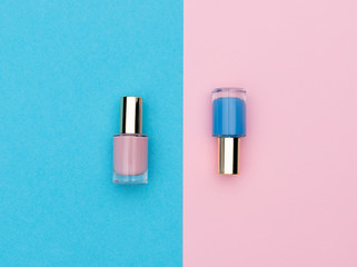 Flasks of pink and blue nail polishes - obrazy, fototapety, plakaty