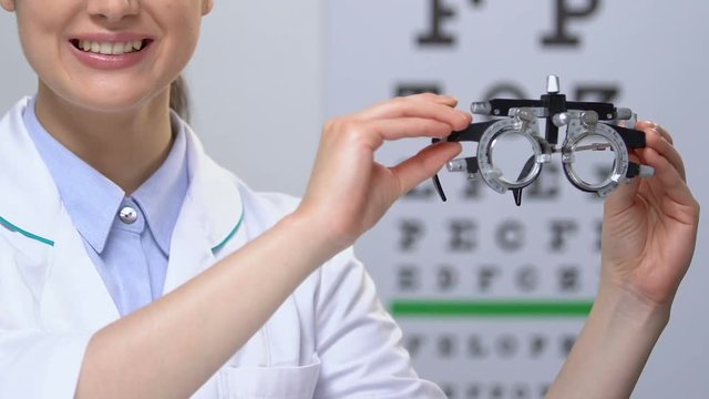 Ophthalmologist showing phoropter, vision checking device, medical equipment