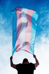 young person with a transgender pride flag - obrazy, fototapety, plakaty