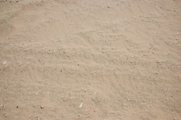 yellow sand the surface of small stones background