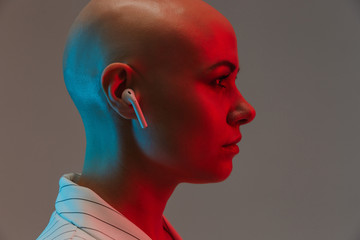 Portrait of an attractive bald woman wearing jacket